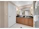 Well-lit bathroom boasting a double sink with granite countertop and tiled floors at 145 E Harmon Ave # 2411, Las Vegas, NV 89109
