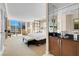 Bright bedroom features a comfortable bed, sitting area, and expansive windows offering city views at 145 E Harmon Ave # 2411, Las Vegas, NV 89109
