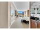 Bright bedroom features a comfortable bed, sitting area, and expansive windows offering city views at 145 E Harmon Ave # 2411, Las Vegas, NV 89109