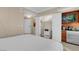 Bright bedroom featuring built-in storage, a kitchenette, and elegant furnishings at 145 E Harmon Ave # 2411, Las Vegas, NV 89109