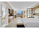 Bright bedroom features a comfortable bed, sitting area, and expansive windows offering city views at 145 E Harmon Ave # 2411, Las Vegas, NV 89109