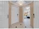 An inviting entryway showcasing a tiled floor, neutral paint, and access to the rooms at 145 E Harmon Ave # 2411, Las Vegas, NV 89109