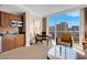 Inviting living room area with kitchenette and city view, perfect for relaxing and entertaining at 145 E Harmon Ave # 2411, Las Vegas, NV 89109