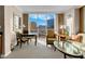 Comfortable living room featuring large windows with a scenic cityscape view at 145 E Harmon Ave # 2411, Las Vegas, NV 89109