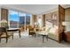 Cozy living room boasts comfortable seating, city views, and a stylish design at 145 E Harmon Ave # 2411, Las Vegas, NV 89109