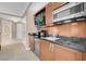 Living room featuring wood trim, television, and coffee/wine bar at 145 E Harmon Ave # 2411, Las Vegas, NV 89109