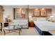 Inviting main bedroom offering a cozy sofa and well-lit bedside tables for added comfort at 145 E Harmon Ave # 2411, Las Vegas, NV 89109