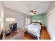 Cozy bedroom with natural light, wood floors, and comfortable decor at 1466 Fieldbrook St, Henderson, NV 89052