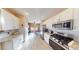 Well-lit kitchen with white cabinetry, granite countertops, and stainless steel appliances at 1466 Fieldbrook St, Henderson, NV 89052