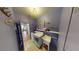 Laundry room with a washer, dryer, sink, and shelving for storage at 1466 Fieldbrook St, Henderson, NV 89052