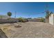 Wide backyard with brickwork accents, a fire pit, privacy wall, and a relaxing hammock at 1645 Chestnut St, Henderson, NV 89011