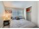 Comfortable bedroom featuring a cozy bed, a window with blinds, and a convenient closet space at 1645 Chestnut St, Henderson, NV 89011