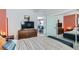 Cozy bedroom with a large TV, a comfortable bed, and a view into the dining area at 1645 Chestnut St, Henderson, NV 89011