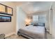 Cozy bedroom with neutral tones, carpeted floors, and a comfortable queen-sized bed at 1645 Chestnut St, Henderson, NV 89011