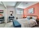 Comfortable bedroom featuring a vanity table, stylish decor, and a cozy bed with striped bedding at 1645 Chestnut St, Henderson, NV 89011