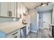 Bright kitchen boasts stainless steel appliances, quartz countertops, and modern track lighting at 1645 Chestnut St, Henderson, NV 89011