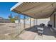 Covered patio area perfect for outdoor seating and entertaining with a spacious backyard and hammock at 1645 Chestnut St, Henderson, NV 89011