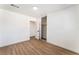 Bedroom featuring wood-look floors and closet with open doors at 1648 J St, Las Vegas, NV 89106