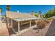 Backyard featuring covered patio with tiled roof and desert landscaping for low maintenance at 1751 Juniper Twig Ave, Las Vegas, NV 89183