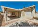 Charming backyard with a covered patio and low-maintenance gravel landscaping at 1751 Juniper Twig Ave, Las Vegas, NV 89183