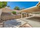 Relaxing backyard with covered patio, terraced garden beds and desert landscaping for easy upkeep at 1751 Juniper Twig Ave, Las Vegas, NV 89183