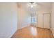 Cozy bedroom featuring hardwood floors, a ceiling fan, and a double-door closet at 1751 Juniper Twig Ave, Las Vegas, NV 89183