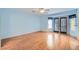 Airy bedroom with wood floors, large window and access to balcony at 1751 Juniper Twig Ave, Las Vegas, NV 89183