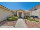 Inviting single-story home with well-kept landscaping, a charming fountain, and a welcoming entrance at 1751 Juniper Twig Ave, Las Vegas, NV 89183