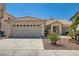 Inviting single-story home boasts desert landscaping, tile roof, and a spacious two-car garage at 1751 Juniper Twig Ave, Las Vegas, NV 89183
