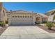 Charming single-story home featuring a tile roof, well-manicured landscaping, and a spacious two-car garage at 1751 Juniper Twig Ave, Las Vegas, NV 89183