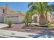 Lovely single-story home with desert landscaping, mature palm trees, and a well-maintained yard at 1751 Juniper Twig Ave, Las Vegas, NV 89183