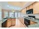 Well-equipped kitchen features granite countertops, stainless steel appliances, and ample cabinet space at 1751 Juniper Twig Ave, Las Vegas, NV 89183