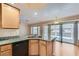 Bright kitchen with granite countertops, stainless steel dishwasher, and convenient access to the patio at 1751 Juniper Twig Ave, Las Vegas, NV 89183