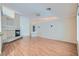Spacious living room with hardwood floors, a cozy fireplace, and ample natural light at 1751 Juniper Twig Ave, Las Vegas, NV 89183