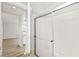 Bright bathroom showcasing a shower with glass door, and a hallway view to the living room at 1800 Edmond St # 226, Las Vegas, NV 89146