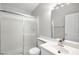 Bright bathroom featuring a shower with glass doors, a modern vanity with a new sink and faucet at 1800 Edmond St # 226, Las Vegas, NV 89146
