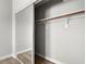 Spacious closet with sliding mirrored doors and a shelf with a wooden rod and supports at 1800 Edmond St # 226, Las Vegas, NV 89146