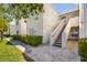 Beautiful two-story condo building with manicured landscaping and inviting staircases to upper units at 1800 Edmond St # 226, Las Vegas, NV 89146