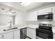 Well-equipped kitchen features modern appliances and ample counter space for cooking at 1800 Edmond St # 226, Las Vegas, NV 89146