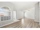 Open-concept living space features modern flooring, arched windows, and a ceiling fan for added comfort at 1800 Edmond St # 226, Las Vegas, NV 89146