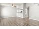Bright, open-concept living space with sleek flooring, modern kitchen access, and ample natural light at 1800 Edmond St # 226, Las Vegas, NV 89146