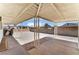 Spacious covered back patio with gravel landscaping and block wall surround at 1905 Aquarius Dr, Las Vegas, NV 89102