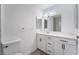 Bathroom featuring a vanity with white cabinetry, modern lighting, and framed mirrors at 1905 Aquarius Dr, Las Vegas, NV 89102