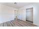 Open bedroom view featuring wood-look flooring and a closet with sliding doors at 1905 Aquarius Dr, Las Vegas, NV 89102