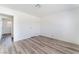 Clean bedroom with wood-look flooring and ample natural light at 1905 Aquarius Dr, Las Vegas, NV 89102