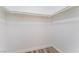 Empty walk-in closet with ample storage and wood-look flooring at 1905 Aquarius Dr, Las Vegas, NV 89102