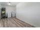 Functional laundry room equipped with a washer, dryer, and wood-look flooring at 1905 Aquarius Dr, Las Vegas, NV 89102