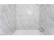 Close-up of the shower with marble-look tile and modern fixtures at 1905 Aquarius Dr, Las Vegas, NV 89102