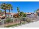 Balcony view showcasing palm trees, neighborhood homes, and lush landscaping at 191 Reed Ln, Henderson, NV 89074