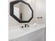 Stylish bathroom vanity with a white countertop, decorative mirror, and modern fixtures at 191 Reed Ln, Henderson, NV 89074